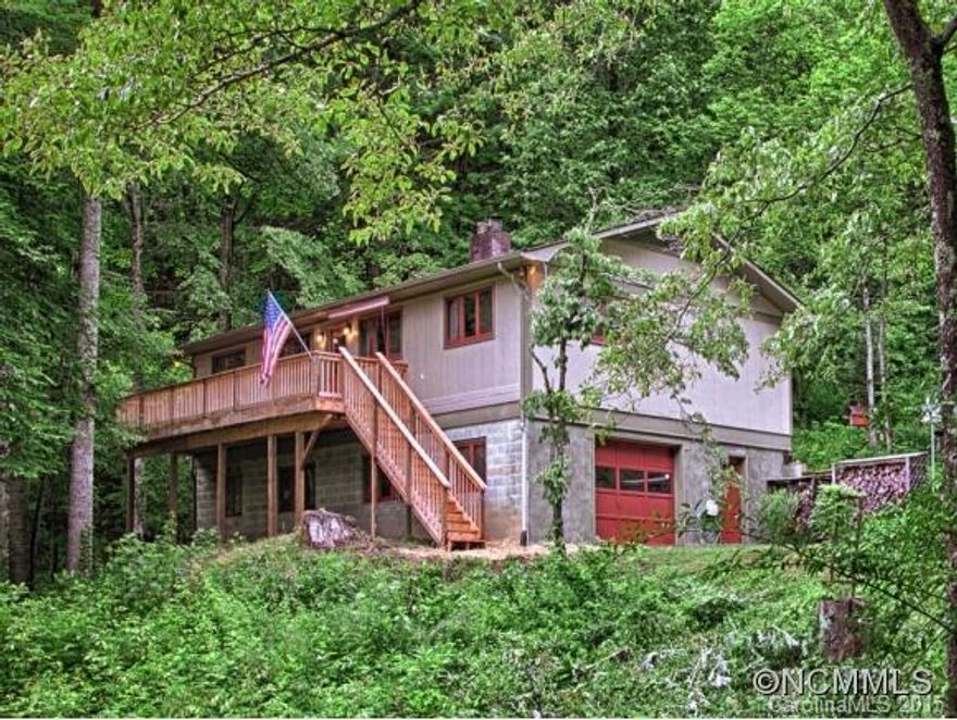 This renovated home with craftsman touches offers two large master suites, crisp newer exterior paint, hardwood floors, beautiful cabinets, stainless steel appliances, marble counter tops, custom built in shelves, large single base farmhouse kitchen sink, wainscoting, updated lighting, wood burning fireplace with granite hearth, new front deck to take in the summer and winter views, brand new master bathroom with dual vanity and more.