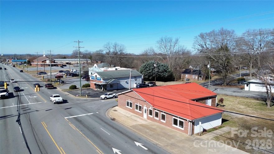 Prime Commercial Property in “Boom Town” Lincolnton, NC 
If you’ve been waiting for the perfect location to turn your business dream into reality — this is it. 
Located on a highly visible signalized intersection in Lincolnton, North Carolina, this well-positioned commercial property sees an average of 27,500 vehicles per day (2024 NC DOT) — giving your business exposure most can only wish for.  This versatile 3,100+ square-foot space has been opened up to the studs, offering a blank canvas ready for your vision. The layout is already plumbed for two bathrooms and includes two entrances — perfect for flexible configurations and multiple business uses. Whether you imagine:  a boutique retail store, an artisan bakery or café, a studio space for art or fitness, a professional office suite,  A service-oriented business, this location supports dreams becoming reality.  Lincolnton: A Thriving Community With Strong Economic Footing. Located in Lincoln County, Lincolnton offers an engaged local customer base with a population that continues to grow year-over-year and well-above average household income levels — creating opportunity for retail, services, and business growth alike. Lincoln County residents enjoy a solid household income level above national averages, supporting discretionary spending and local commerce — a key factor for retail and service businesses looking to thrive. Lincolnton’s community is tight-knit, invested, and increasingly welcoming to new enterprises. Over 3,100 sq. ft. of usable commercial space. Interior open to the studs — design it your way, plumbed for two bathrooms, two storefront entrances, 27,500+ AADT traffic (2024 NC DOT)
Generous unmarked parking — brand it how you see fit. Located in one of the region’s most active business corridors Ideal for retail, service business, office, studio, or creative use. Why This Matters Lincolnton - isn’t just another small town — it’s a growing commercial hub within a powerful regional market. With robust traffic counts and a local economy supported by households with solid income levels, your business doesn’t just get exposure… it gets customers! This is your opportunity to build your brand in a community that embraces local business. Don’t let another entrepreneur beat you to it.