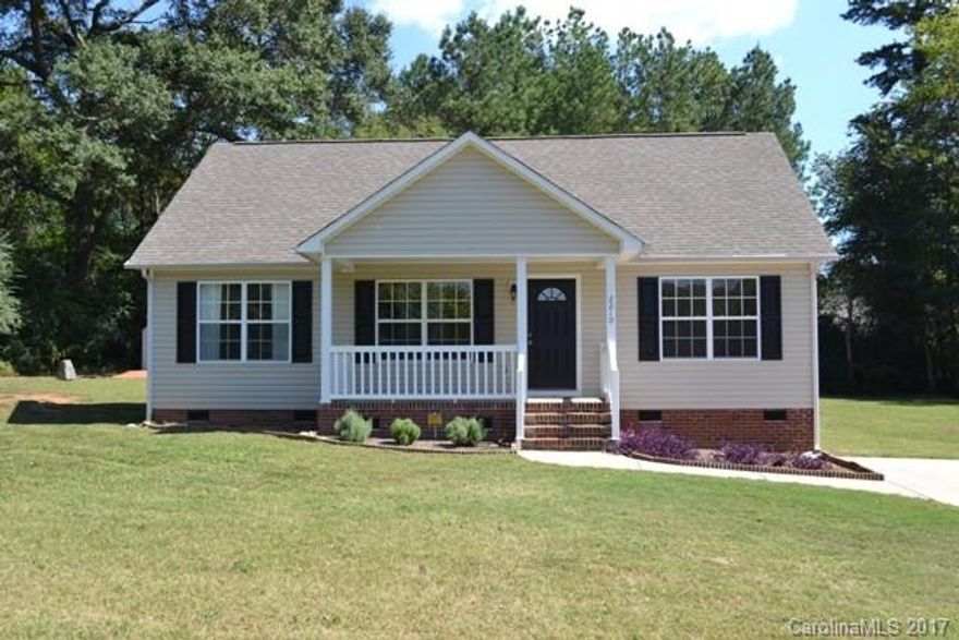 What a dollhouse!  This home sits on an acre lot, has a split bedroom plan and some updates.  Rinnai tankless water heater, newer heat pump, new stainless appliances.  There is gas hookup for a gas range.  Vaulted great room with fireplace/new gas logs,  spacious kitchen with breakfast bar.  Wired 12x16 building.  Hurry - this won't last long!