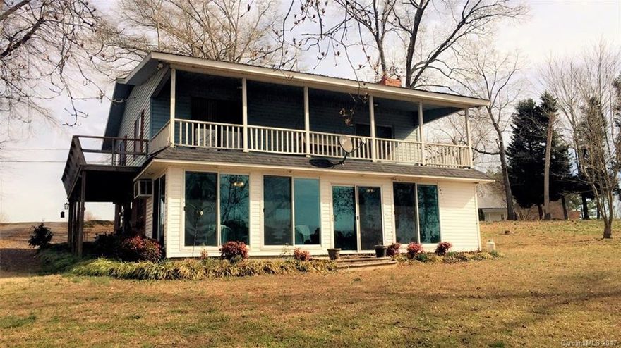 LAKE LIFE STARTS HERE! Looking for year round fun on Lake Tillery? This wonderful home of 4 bedrooms/2 full baths has it to offer! With 130 Feet of water frontage, sizable pier great for entertainment, deep water for swimming, & prime spot for fishing! Enjoy the beautiful Tillery sunsets from your covered porch and cozy glass sunroom! Water view from every bedroom!! Prime location! COME SEE IT TODAY!