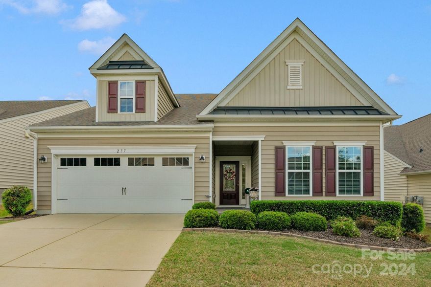 Highly desirable Dorchester model. Primary and two secondary bedrooms downstairs and an additional loft and bedroom up with full bath. Primary has space for sitting area or office that leads out to the enclosed screened porch. Large kitchen with gas cooktop and oversized island is open to the family room which has the optional four foot extension. Paver patio out back is great to sit and relax. Resort style amenities includes pool, fitness center, walking trails and is convenient to all that Indian land and South Charlotte have to offer with the low Lancaster taxes.