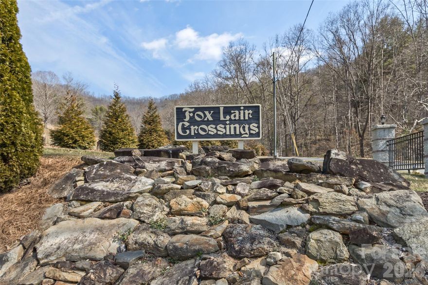 Home is located in Fox Lair Crossings Subdivision a beautiful quiet Gated Community located adjacent the Reems Creek Golf Course & just minutes from Unique Downtown Weaverville. This home is on .45 acres and features 5 or 6 bdrms, 3 full baths the main living area is open concept with cozy gas fireplace.  Open inviting floor plan for everyday living entertaining. Great for gatherings, grilling, and relaxing evenings. Kitchen has Stainless Steel Appliances, Quartz Countertops with Tile Backsplash. Enjoy outdoor living with breathtaking long range mountain views on a covered porch off the living area relax & enjoy the peaceful sound of nature. Rise & Shine to a beautiful morning on the deck. Relaxing way to start your morning. Spacious wide entry way leading to open Kitchen & Family Room. Laundry Room conveniently located on the First floor with entry to 2 Car Garage. Daylight Basement with the potential for mother-in-law suite or additional living space, with separate entrance. Second Level offers Large Bonus Room perfect for a home office, media room or playroom & has 2 large bedrooms to maximize every sq ft. Second Level has a private entrance/exit to the grassy back yard. Lots of Storage Basement.