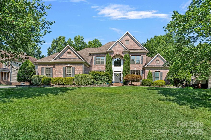 Escape the heat in your own private backyard oasis at this incredible home with stunning resort-like salt water pool! This home is filled with custom and luxurious details & finishes from the pool and designer landscaping with stone accents to the screened porch overlooking the private backyard to new windows, central vac, tankless water heater & 3 car garage! Kitchen designed for entertaining with upgraded custom cabinets, large work island w/ display cabinet, wine fridge, dishwasher w/ two drawers.  Main level primary suite features trey ceiling w/ LED accent lighting, sitting area, ensuite bath w/ oversize shower with multi jets, custom cabinets and huge walk in closet with custom closet organization system. Upstairs are 3 bedrooms & 2 full baths, walk in attic space & library loft with custom built ins. Just down the street are all the neighborhood amenities- clubhouse, pool w/ splash pad & slide, playground, tennis, pickleball & more! Fantastic Ballantyne location w/ low SC taxes!