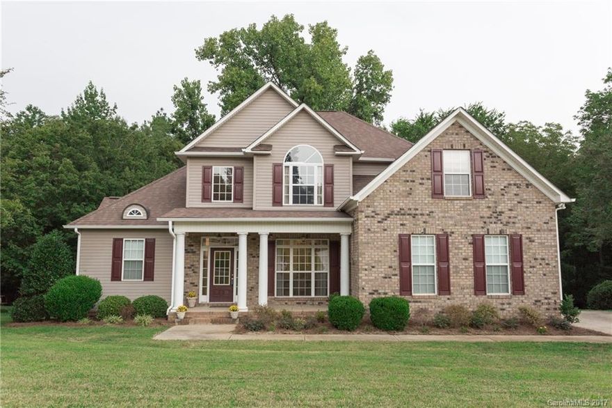 Rare Master on Main with trey ceilings, 5 piece bath, large walk in closet, 2nd bedroom with a full bath in the hall, laundry room with a deep sink, granite counter tops in kitchen, formal dining room, eat in kitchen, and  hardwood in main living area. Upstairs is another 3 bedrooms/bonus room, double vanity in hall bath, and large walk in attic storage.  Over sized 2 car garage with service door on a Large wooded lot with a large deck over looking the woods. New carpet all throughout home.