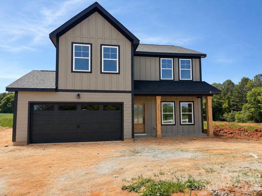 Welcome home to this beautifully crafted property in the heart of Dallas, NC, offering the perfect blend of modern finishes and everyday functionality—without the restrictions of an HOA. Situated on a generous 0.92-acre lot, this home provides space, privacy, and curb appeal from the moment you arrive. A welcoming front porch with cedar columns and a stunning mahogany front door sets the tone for the quality you’ll find throughout. Inside, the main level features durable laminate flooring and a versatile flex space—perfect for a home office or playroom. The kitchen is designed to impress with quartz countertops, a stylish tile backsplash, stainless steel appliances (dishwasher, range, and over-the-range microwave), and sleek black plumbing and lighting fixtures that tie it all together. Upstairs, you’ll find four spacious bedrooms with comfortable carpet, while both full bathrooms showcase quartz countertops and tile flooring. The primary suite offers a beautifully finished tile shower, creating a clean, upscale retreat. Additional highlights include laminate stairs, tile flooring in the bathrooms and laundry room, and low-maintenance fiber cement siding for long-term durability. **Preferred lender offers up to 1% in buyer credit**