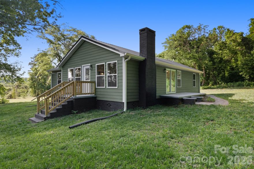 "From Studs To Stunning” 
Completely renovated from top to bottom, this stunning 3-bedroom, 2-bath home with a dedicated office/study/playroom sits on 0.47 acres inside city limits — an incredibly rare find. Featuring a desirable split-bedroom layout, open-concept living with vaulted ceilings, and work-from-home-ready office space, this home offers both functionality and flexibility. Major updates include new Smart Siding, all new plumbing lines, all new electrical wiring, new HVAC system, new water heater, new insulation, moisture barrier in the crawlspace, and a new metal roof, giving the home the feel and quality of new construction. The beautifully updated kitchen features soft-close cabinetry, stainless steel appliances, stylish tile backsplash accents, and modern finishes throughout. Bathrooms showcase gorgeous tiled showers, while new flooring and designer-inspired details complete the home’s move-in ready appeal. New sliding glass doors open to a patio area perfect for relaxing or entertaining while overlooking the backyard. Functional fireplace currently has a temporary seal in place for potential gas log installation. Buyers are advised to have the fireplace and chimney inspected prior to wood-burning use. Conveniently located within walking distance to shopping, dining, medical facilities and everyday amenities. This rare property offers modern living with an oversized in-town lot that is hard to find.