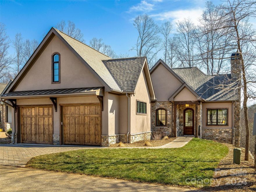 Come home to The Cliffs at Walnut Cove, The Cliffs' fourth gated golf and wellness community located in Asheville, North Carolina.

Social entertaining unfolds effortlessly across an open floor plan, expansive living areas, a screened porch, and a grilling deck. The first floor’s stately primary bedroom suite features heated tile floors in the bath and a large closet directly adjacent to the laundry room for undeniable ease and convenience. A great room with cathedral ceilings offers the spacious space for gathering. A gracious recreation room and two ensuite bedrooms are found on the lower level, along with abundant storage spaces to minimize clutter. On the lower deck you will find a hot tub and an area for a fire pit.

A Club Membership at The Cliffs is available for purchase with this property giving you access to all seven communities.