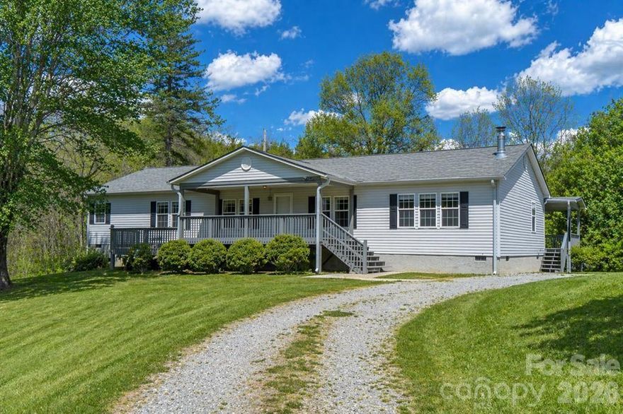 Enjoy peaceful Tuckasegee River views from this spacious 3BR 2BA home, ideally located just off S River Road, one of the area’s most loved spots for fly fishing, tubing, and kayaking. Minutes to Sylva and Western Carolina University, this location offers both convenience and connection to the outdoors. This well designed doublewide offers an open, functional floor plan with true main level living. The central living room flows into a flexible adjoining space, perfect for an office or extra sitting area while a separate family or den opens to the kitchen, creating multiple living areas to spread out and gather. Step outside to front and back covered porches and take in the natural setting, with Mill Creek running through the property as it feeds into the Tuckasegee River. The lower portion of the land is level and located in the flood plain, offering space for recreation and outdoor enjoyment. Located within the Webster ETJ, ordinances do apply. A great opportunity for full time living, a second home, or long term investment in a highly desirable corridor. (interior & exterior photos have been virtually staged to show the vision on what you could create)