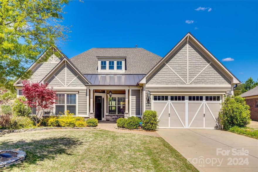 Welcome to this gorgeous home in the Estates at Audubon Lake! This home features  hardwood floors, crown molding, a formal dining room, office area, spacious living room with floor to ceiling stone gas fireplace and an open concept flow. The chef's kitchen features a center island with bar stool seating, granite countertops, gas range, wall oven and SS appliances. There is a drop zone off the garage and the laundry room has built in cabinets and a sink. The primary bedroom on the main floor features trey ceilings, a sitting area and a private ensuite with a dual sink vanity, garden tub, tile shower and WIC. Two secondary bedrooms on the main floor share access to a full hall bathroom. Upstairs there is a loft and a bedroom w/ full bathroom. Enjoy time on the back patio overlooking the private treelined backyard. Located just a short drive to Indian Land, SC, downtown Fort Mill, SC & the Ballantyne area of Charlotte, NC, close to shops & restaurants. Schedule a showing today!