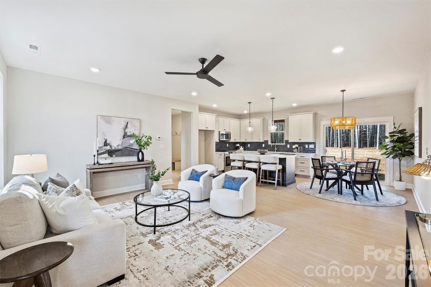 Just completed and now available, welcome to North Pines—Lincolnton’s newest community of thoughtfully designed single-level homes by Brancer Homes. This 1632-square-foot residence at 2295 Lee Lawing Road offers refined finishes, modern comforts, and the peaceful privacy of tree-lined homesites, all just 15 minutes from downtown Lincolnton and convenient to shopping in Sherrills Ford and Denver.

The inviting exterior showcases brick accents and a stained wood front-porch column, creating warm, timeless curb appeal. Inside, the builder’s Lakeside Designer Package delivers an elevated aesthetic with upgraded lighting selections, mixed-tone high-end cabinetry, and quartz countertops throughout for a cohesive, upscale feel.

The open-concept kitchen features pendant lighting over the island, a walk-in pantry, and seamless flow into the main living area—ideal for both everyday living and entertaining. The primary suite offers a spa-inspired retreat with a stand-alone soaking tub, full shower wall tile, and a calming designer color palette complemented by crisp white ceilings.

Thoughtful details continue with a functional drop zone, added recessed lighting, and a well-appointed laundry room with cabinetry and quartz counters.

Now that construction is complete, this home is part of a newly released collection in North Pines—offering a rare opportunity to own move-in ready new construction with elevated design and natural privacy in one of Lincolnton’s fastest-growing areas.
Finishing touches include an extended two-car garage with an exterior exit door and additional driveway parking, offering both convenience and flexibility. Designed for low-maintenance living in a natural, rural setting, this home combines craftsmanship, comfort, and Carolina charm in the heart of North Pines.