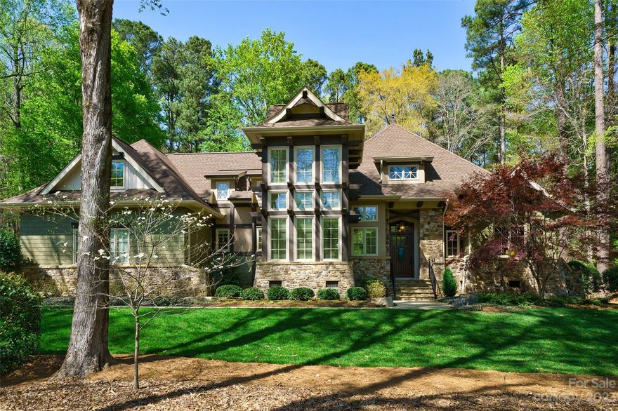 This immaculate home was constructed by the award winning, luxury custom home builder, Kingswood Custom Homes. This picturesque property offers vacation style living with 2 separate living quarters, a putting green, a fire pit, relaxing stone patio, and a covered porch with an outdoor fireplace located at the guest home.
The exterior is stone and cedar with stucco accents creating an architectural masterpiece. The interior exudes elegance with accents of wood and stone throughout both homes.
The main living quarters offers over 3,700 square feet, 4 bedrooms, 4.5 bathrooms and all bedrooms are on first floor.
The guest house is over 1,800 square feet, 2 levels, primary suite on main level, with a bonus room and loft area on second level.
The community offers walking trails, outdoor pool, tennis courts, fitness center, and all residents can enjoy
the beauty of Lake Wylie including access to boating, canoeing, and kayaking. Dock slips are also available
for lease.