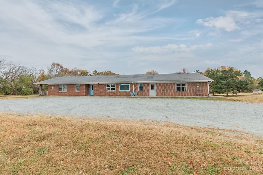 Many possibilities exist for this beautiful brick building in Tyro, NC! This building is in perfect condition with tile flooring, and stained concrete. Retail store, coffee shop, hair salon, whatever you are looking for, this building would be perfect! Currently separated into 2 mixed use spaces but can be opened into 1 space or sectioned off into more than 2 spaces. Includes kitchen area and 5 restrooms. Lots of outdoor space with approximately 1.31 acres per tax records. Gravel parking lot, and room for expansion. Could be turned into a duplex also, with two septic systems, and two HVAC units. PRIME LOCATION, HIGH TRAFFIC AREA LOCATED WEST OF THE CITY OF LEXINGTON – NO CITY TAXES HERE!