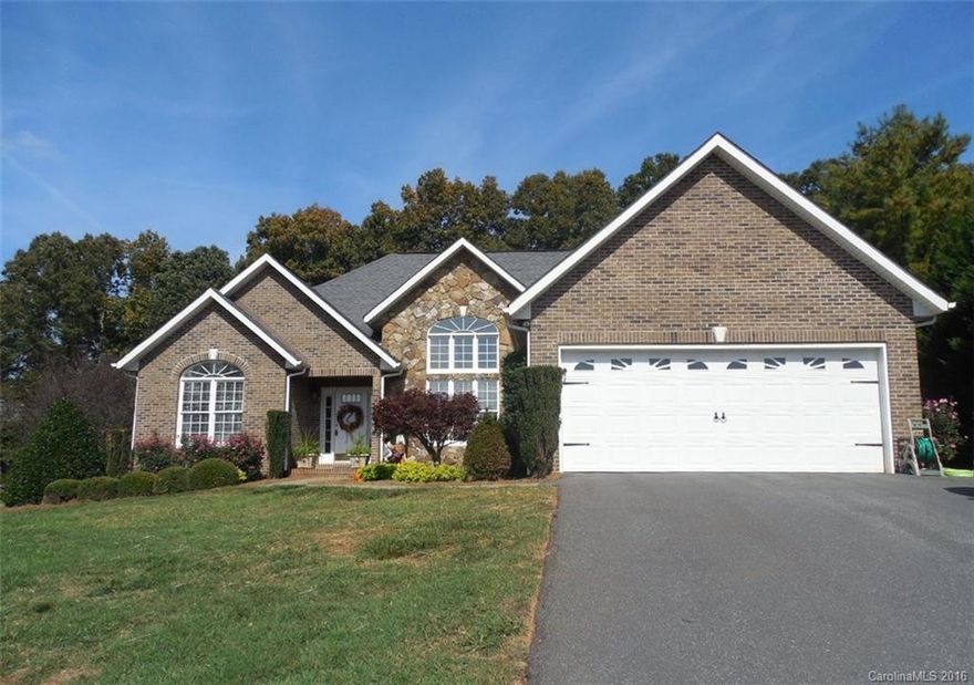 This 3BR, 2BA, brick ranch has a 14x18 sun room that was added in 2014. Move-in ready with hardwood floors in the great room, kitchen, dining & halls. Granite counters & back splash in this large kitchen. Lots of cabinet & counter space. Recessed lighting added & crown molding. Both baths remodeled with new tile & faucets (11-2016). All appliances remain including the stainless refrigerator. Great room has a cathedral ceiling & a rock fireplace with gas logs. Master bedroom has a tray ceiling.