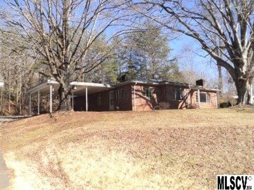 Brick house on 1.7 acres plus 3 acre lot is zoned for business.  3BR/1BA would be great home or investment opportunity. Commercial property with over 700 feet of road frontage. Great location on Hwy. 321 near shopping and schools.