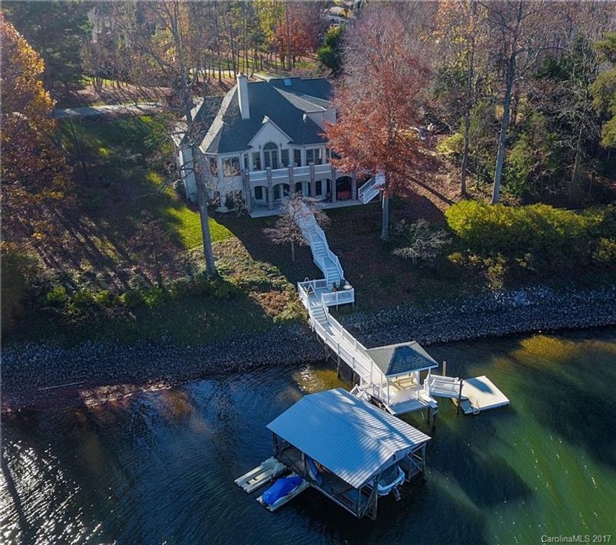 Elegant 2 story/basement home on 220 ft of pristine Lake Norman Shoreline. Enjoy all the lake has to offer from nice cove w/huge open water views. Traditional plan-MBR on main lvl, 2 BRs & bonus up. Full basement w/large entertainment space in Rec rm, bar, wine cellar, billiards, workshop & 2nd MBR w/ensuite bath. Large gourmet kit has amazing water views. Expansive upper & lower concrete patios, private low maintenance dock/stairs, gazebo & covered boat slip & lift. Welcome to the Lake Life!