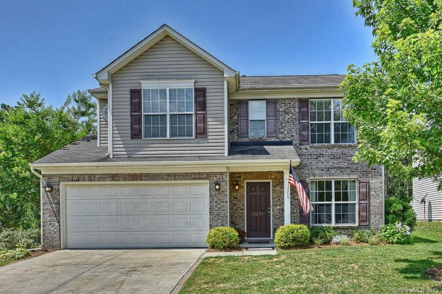 Multiple offers. Highest and best due by Tuesday, 6/23 at 12:00 pm.  Amazing home in highly desirable Tega Cay ! Features include: private, fenced back yard overlooking wooded natural area, maintenance free exterior with brick/ vinyl siding, new laminate floors in foyer, family room, breakfast area and kitchen, updated kitchen with granite counters, 42 inch cabinetry, stainless appliances. Master bath features garden tube and separate shower.  Covered patio and quiet cul-de-sact street!