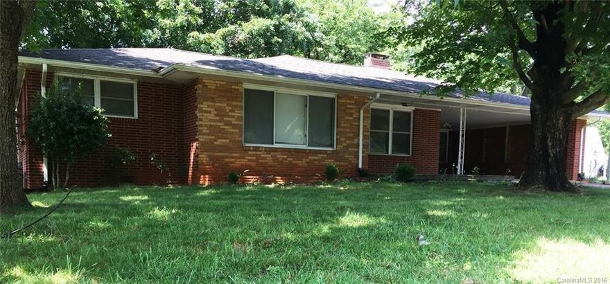 East Rowan Brick Ranch with walk out BASEMENT offers over 1,500 square feet with 3 bedrooms and one full bath, double garage, newer roof and a big yard with great shade trees.