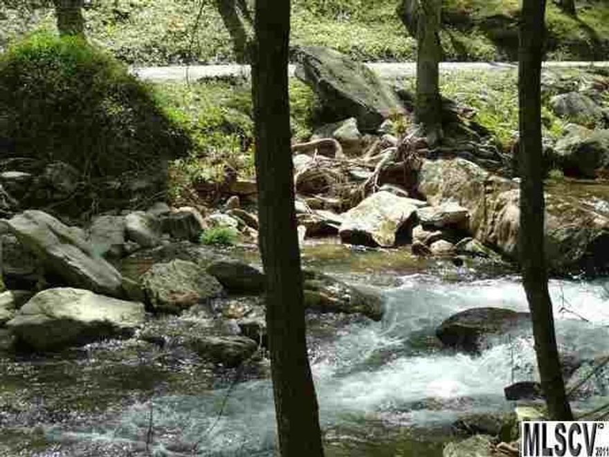 Want to live in the heart of nature? This 3 acre tract of beautiful mountain land adjoins Pisgah National Forest and fronts on Anthony Creek, a bold, rushing creek loaded with fish.  Take a short walk to a nearby water fall that is absolutely gorgeous! If you like to snow ski, you are just a short drive from nearby slopes in Blowing Rock and Beech Mountain. Building restrictions are minimal (600 sq. ft.enclosed wood structure, no exposed cement blocks , no mobile homes, and there are no HOA fees.)