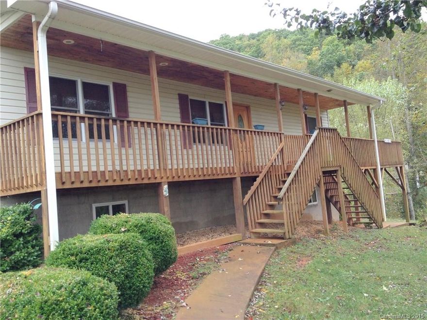 Hardwood floors and Hardwood ceilings, Wrap around front covered deck  to large side decking.  Basement Plumbed for a 3rd bathroom with HVAC and supplemental wood stove heat, two outside walkout rooms from basement.  A 24'X30' detached  Cement Block garage/workshop