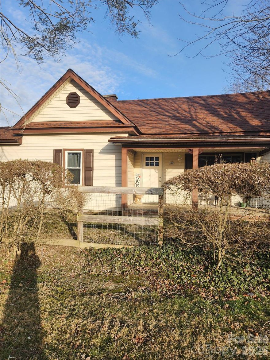 Built-in 1941 this home has many of the original features like the original doors and door knobs in the bedrooms, original hardwood flooring a lot of storage space a storage building with a loft beside the house and another storage building behind the home, two car carport also fence surrounding complete property. 0.58 acre mostly all level, completely new pecks underneath house, complete new remodeled kitchen, 4 new windows in house new wiring in attic new propane heater propane heat, new septic tank in 2018, sunroom let's a huge amount of sun in, quiet neighborhood close to downtown Hendersonville, hospital, grocery store etc great home for someone that is purchasing for home the first time.