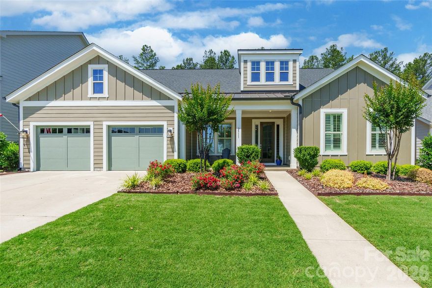 Welcome to this beautifully designed 4-bedroom home in the highly desirable Paddlers Cove community, offering the perfect blend of comfort, style, and outdoor living. Featuring a spacious open floor plan with an upstairs loft, this home was made for easy everyday living and effortless entertaining.

The gourmet kitchen is a true centerpiece, complete with a gas cooktop, walk-in pantry, and plenty of space to gather. The main-level primary suite provides a private retreat, while the additional bedrooms and loft offer flexibility for guests, work, or play. Elegant plantation shutters throughout the home adds timeless charm and sophistication.

Inside, you'll find a beautiful gas fireplace anchoring the main living area, creating a warm and inviting atmosphere. Step outside to an incredible extended patio designed for year-round enjoyment, featuring a second gas fireplace, outdoor kitchen, and firepit, the ultimate outdoor living space for relaxing or entertaining.

Located in sought-after Paddlers Cove, residents enjoy resort-style amenities including two community pools, a clubhouse and is walking distance to Field Day Park, which offers pickleball courts, athletic fields, playgrounds, and scenic walking trails. This home truly offers the lifestyle buyers are looking for.