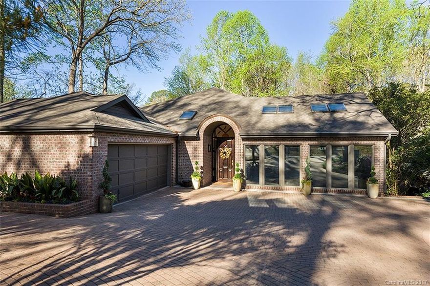 Totally remodeled home with spectacular view of lake. Updated white kitchen/glass backsplash, new stainless appliances, granite tops & wood floors. Unique & impressive. Two master bedrooms, mahogany front door leads to gallery entry hall with barrel ceiling & marble floors.  Open concept. Perfect for entertaining. Beautiful studio/office. Tons of storage. List of improvements available. Walking distance to country club, marina & tennis courts. Owner is a designer and it shows.