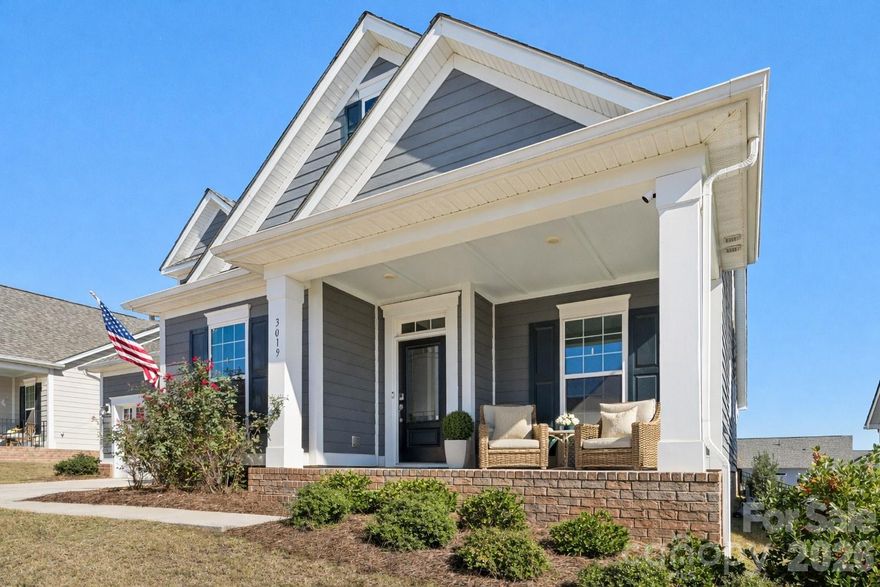 This beautifully maintained home offers the perfect blend of comfort, style, and flexibility, with an open floor plan designed for modern living. The main level features two bedrooms—including a stunning primary suite—plus a dedicated office, ideal for guests, multigenerational living, or working from home.
From the moment you walk in, you’ll notice the details—tray ceilings, crown molding, wainscoting, and rich hardwood flooring—creating a refined yet welcoming feel throughout. The light-filled living room with fireplace flows seamlessly into the dining area and a chef’s kitchen complete with granite countertops, soft-close cabinetry, gas cooktop, oversized island, butler’s pantry, and custom walk-in pantry.
The primary suite is a true retreat, featuring dual marble vanities and a spa-inspired walk-in shower with seating.
Upstairs, you’ll find two additional bedrooms, a full bath, an oversized loft, and a versatile bonus room or private office—easily a fifth bedroom.
Step outside and enjoy your own private escape with a covered porch overlooking a beautifully landscaped, fenced backyard and patio—perfect for relaxing or entertaining.
Located in the highly sought-after Millbridge community, residents enjoy resort-style amenities including a clubhouse with theater and coffee bar, fitness center, tennis courts, covered basketball court, walking trails, and more—all just minutes from charming downtown Waxhaw.
Zoned for Waxhaw Elementary and Parkwood Middle & High School, with a brand-new Parkwood Middle building opening in 2026.
Luxury, space, and lifestyle—perfectly combined in one exceptional home.