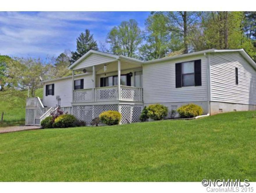 Beautiful, peaceful setting surrounds you in this updated manufactured home. Enjoy front and rear decks, HVAC, large great room with fire place, master suite with garden tub & shower, open eat in kitchen with island and all the cabinets needed, all close to downtown Waynesville and Lake Junaluska.