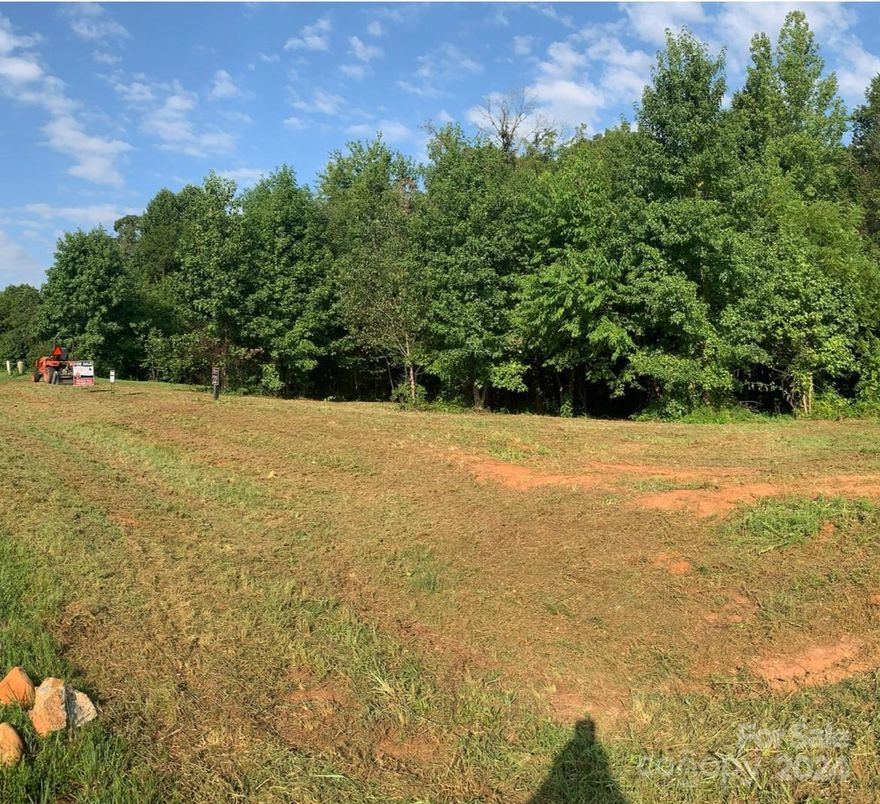 Don't miss your opportunity to purchase this beautiful large lot in River Rock. This is a gated community in NW Statesville. There is community access to the Catawba River where you can fish, launch a paddleboat or enjoy a picnic by the river.  Convenient location with easy access to I-40, sitting right between Winston-Salem, Hickory &  is not far from Mooresville, Troutman & downtown Statesville. This .68 acre lot offers gorgeous buildable space and has a perc approval for a 4 bedroom gravity septic system with Iredell County! In addition, water can be tapped into!