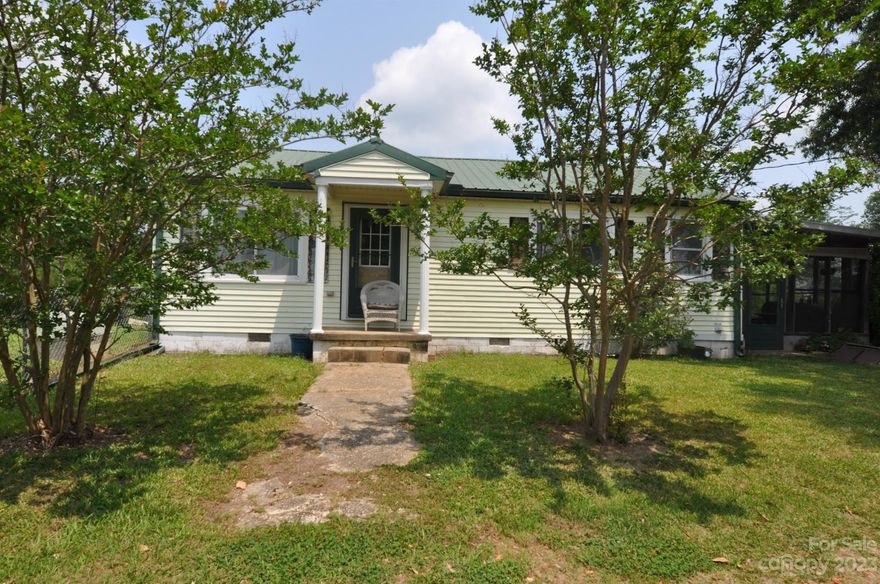 Private 2 Bedroom 2 bath Farmhouse on 12 secluded acres.  Kitchen has a true farmhouse sink with window views of a beautiful Magnolia Tree and the pasture.  Original hardwood floors in the living room and both bedrooms.  Both bedrooms have private baths. Master bath has a farmhouse vanity/sink and shower only.  Home has a propane heater as well for those chilly nights.  Enclosed covered patio for relaxation.  Several barb wired pastures.  Two wells on the property. 2160 square foot barn with 5 stables, tac room, wash room and plenty of room for more stalls.  Stalls have exiting doors as well. Lean too off the side of the barn. Barn has electricity and water.  Chicken coop in an enclosed area.  Large open pasture with a small pond. Wired storage building with two lofts and a side lean too. Peach and pear trees on the property along with several great spots for a garden.  Bring the horses, chickens, goats and the atvs. Convenient to Columbia and Charlotte.