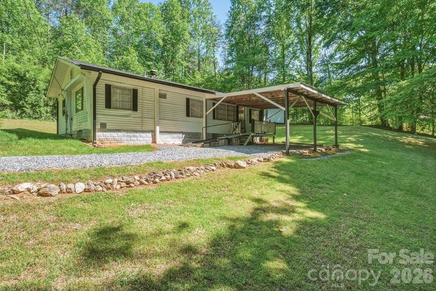 This one-of-a-kind property invites you to step back in time and experience a simpler way of life. Originally a 1966 single-wide manufactured home, this residence was thoughtfully expanded by a stick-built structure in 1986-blending vintage charm with enduring craftsmanship. Lovingly maintained over the years, this cozy home offers 2 bedrooms and 1 bath, filled with warmth, character, and a sense of nostalgia you just can't replicate. Nestled in a private clearing on a beautiful 1-acre lot, you'll enjoy peaceful surroundings. Conveniently located between Statesville, Taylorsville, and Hickory, you get the best of both worlds - serenity and accessibility. If you've been dreaming of a place where time slows down and charm takes center stage, this hidden gem is ready to welcome you home.