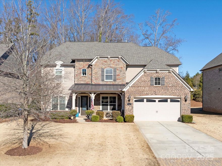 Located just 30 minutes from Uptown Charlotte & less than 10 minutes from Ballantyne & Fort Mill’s downtown, this beautiful home offers a seamless blend of style, comfort & convenience. Hardwood flooring flows throughout the main floor, complementing an open floor plan with a formal dining room, eat-in kitchen & expansive kitchen island. The kitchen features a farmhouse sink, stainless steel appliances, wall oven & gas cooktop. Upstairs, find the great bonus room with closets, a private bedroom, jack & jill bed/bath combos & the primary suite with a spacious walk-in closet, luxurious garden tub, walk-in shower & double vanity. A bedroom & full bath on the main level add flexibility. Outdoor living is a delight with a level, fenced yard & a large, covered patio with a ceiling fan. Two dedicated home office spaces provide functionality & privacy. Enjoy the community pool & a prime location close to shopping, dining & major roadways. This home has everything you need for modern living!