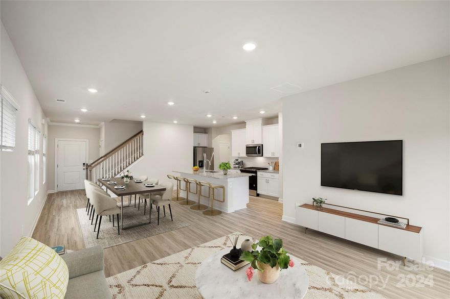 This stunning home in Henderson Manor is designed with modern elegance and high-end efficiency in mind. Featuring a thoughtfully curated exterior with distinctive architectural details, Bermuda sod landscaping, and low-maintenance vinyl siding with brick veneer accents, it boasts curb appeal and durability. Inside, raised panel doors, gleaming LVP flooring, and fresh neutral paint create a welcoming atmosphere. The spacious kitchen is a chef’s dream, offering granite countertops, custom cabinetry, stainless steel appliances, and a large pantry. Luxurious bathrooms include modern fixtures and tile finishes. Energy-efficient features including water heater, insulated ducts, and ENERGY STAR certification ensure sustainability and comfort. With smart home capabilities and access to community amenities, this home delivers the perfect blend of style, function, and technology.