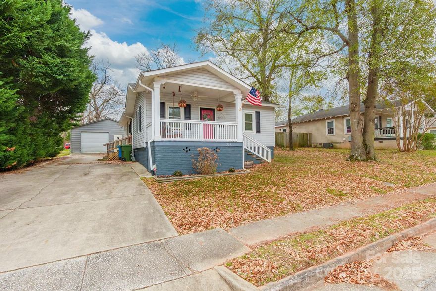 Charming 3-bedroom, 2-bath bungalow located in an award-winning school district. This inviting home features beautiful hardwood floors throughout and an updated kitchen with modern finishes, perfect for everyday living and entertaining. Both bathrooms have been tastefully updated for comfort and style. Enjoy relaxing mornings on the welcoming front porch, and take advantage of the large detached garage with an additional workshop—ideal for hobbies, storage, or extra workspace. A wonderful blend of character, functionality, and location, this home is a must-see!