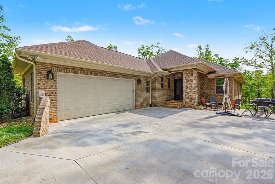 Priced Below Appraised Value.Welcome to luxury waterfront living at its finest—nestled on a private peninsula within an exclusive gated community, this stunning ranch-style home offers breathtaking lake views from most areas of the home. In addition, this home offers breathtaking mountain views.

Designed with elegance and comfort in mind, the home features soaring 10-foot ceilings throughout most of the interior, 8 Foot Doors, enhanced by heavy crown molding, and rich bamboo flooring, tile and plush carpet. Natural light pours into the spacious layout, creating a warm yet refined atmosphere.

The gourmet kitchen is a true centerpiece—complete with granite countertops, a large island with a gas cooktop, 42-inch soft-close cabinetry and a walk-in pantry—perfect for both everyday living and entertaining. Adjacent, a separate dining room provides the ideal setting for formal gatherings.

Relax and unwind in the expansive sunroom or step out onto the screened-in porch or patio where serene lake and mountain views create a peaceful retreat. 

The spacious primary suite offers a luxurious escape with dual closets and a spa-inspired en-suite with wet room and dual vanities. Two Secondary bedrooms are generously sized, with sharing a large adjoining bath, thoughtfully positioned for convenience. A dedicated office with French Pocket doors.

Additional highlights include a stylish half bath with elegant chandelier lighting, a well-appointed laundry room, and a wood-burning and gas fireplace with a blower for cozy evenings.

This exceptional home blends luxury, functionality, and unmatched waterfront views—offering a lifestyle of comfort, privacy, and sophistication.

Design and build your custom pier- already approved and ready to be tailored to your vision. 


Residents of The Springs enjoy premier lake access to High Rock Lake, along with a wealth of private community amenities including a clubhouse, outdoor pool, hot tub, tennis and pickleball courts, scenic walking trails, boat launch, community piers, boat and RV storage, picnic areas, and a peaceful pond.

Discover more about this exceptional community at www.thespringsathighrock.org