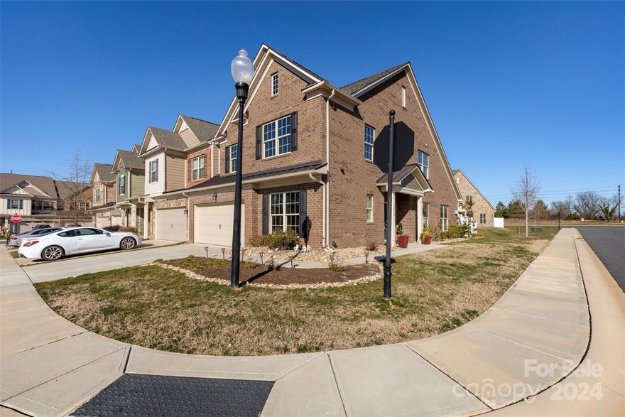 This beautiful well kept townhome end-unit is located in the BridgeMill community and was built in 2019! You walk into this amazing home and immediately see an open floor plan with the kitchen and breakfast room extending into the main living room with a vaulted ceiling and a beautiful stone fireplace. The kitchen has beautiful granite countertops and 2 pantries. The primary bedroom is located on the main level bathroom with heated tile flooring, full walk-in shower & full walk-in closet. Completing the main floor is a half bath, a spacious laundry room and a walk-in coat closet. The second floor has two spacious bedrooms, a full bathroom, a loft area, and a bonus room ideal for a tv room/study/extra guest bedroom. All windows include plantation shutters, motorized remote controlled Levelor blinds, and tinted energy efficient windows. Finally, an extended fenced in outdoor patio with 12’x20’ Pergola with roof on a 2 tiered stamped concrete patio with artificial turf.  You will love it!