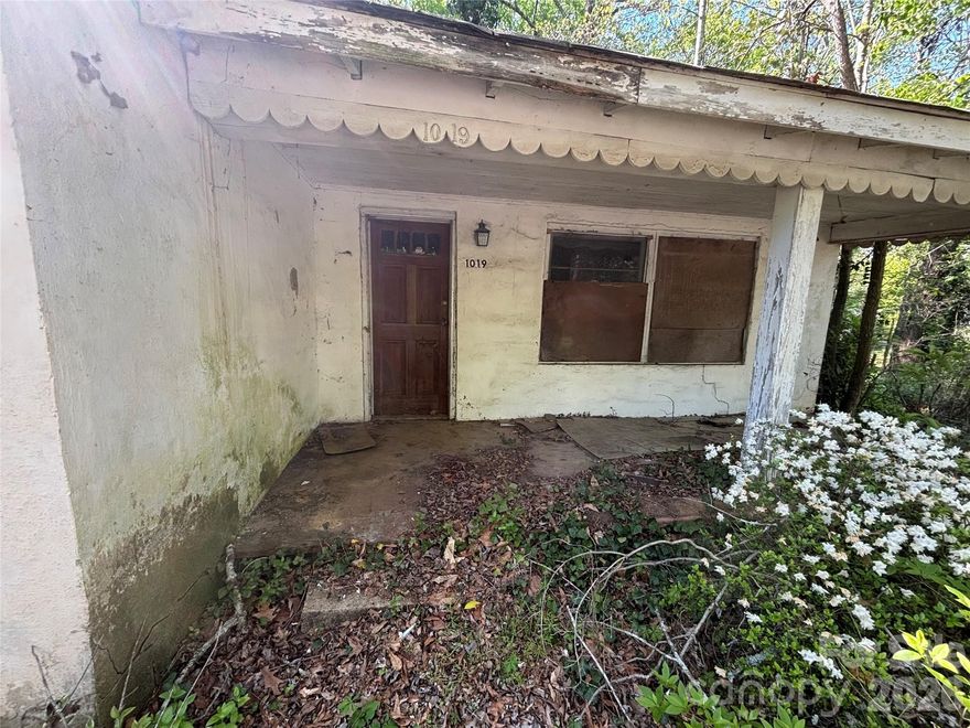 This one is tore up and needs a full rehab. Watch your step as there are holes in the floor and the ceiling.