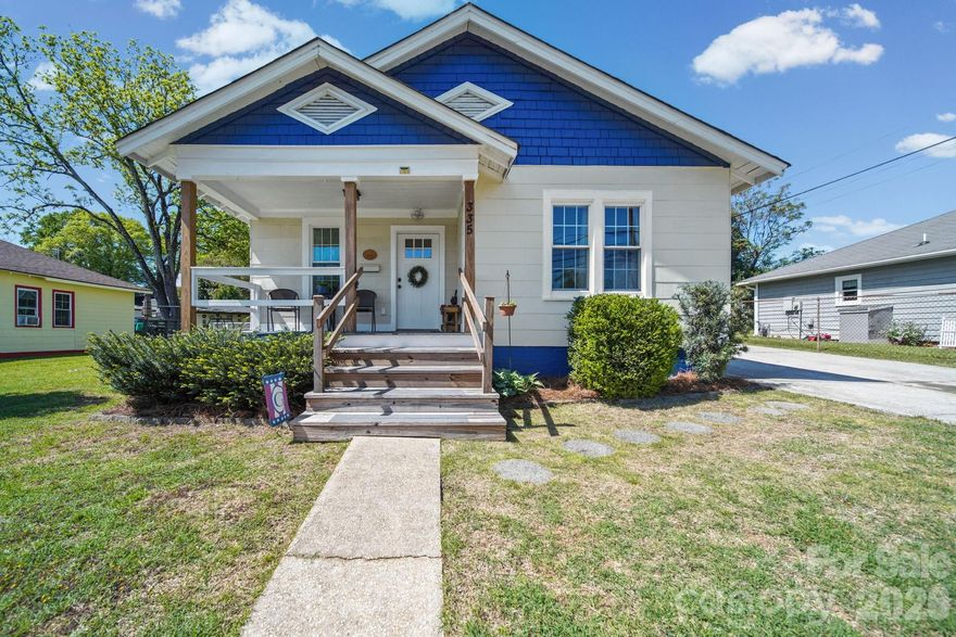 This totally renovated Cramerton bungalow seamlessly blends modern high-end finishes with a deep sense of local history. From the street, wide front stairs lead to a welcoming front porch that perfectly introduces this pristine home. Inside, the open-concept floor plan is anchored by glowing hardwood floors that flow through every room, complemented by solid, custom-made wood doors that underscore the renovation's quality.

The heart of the home is the brand-new kitchen, featuring custom butcher-block countertops and a one-of-a-kind eat-in breakfast bar crafted from reclaimed wood sourced from the Historic Chronicle Mill in Belmont. The bathroom has been completely transformed into a spa-like retreat, featuring a modern walk-in shower and high-end finishes.

The living space extends outdoors to a dreamy back porch and a massive covered patio that overlooks a level, fully fenced backyard—an ideal setting for year-round entertaining. For those with a green thumb or a need for extra gear, the shed out back is perfect for potting or storage. Practicality is a priority here, with a double-wide driveway offering ample parking. Located in a highly desirable Cramerton neighborhood, you are just a short, scenic walk from downtown shops, local eateries, and the beautiful trails of Goat Island. This is a rare opportunity to own a piece of history in a truly turn-key home.