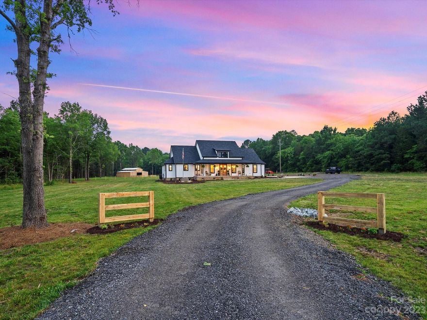 This newly built modern farmhouse sits on almost 10 acres just outside of Rock Hill, featuring a hardi-plank exterior, stained wood columns & black vinyl 2x hung windows! When you walk through the dual Mahogany front door you're welcomed into the heart of the home boasting 20' ceilings, floating wood shelves, & windows overlooking the farm. This open concept design is the floor plan of your dreams, flooding the home with loads of natural lighting and space big enough for a crowd. The oversized master ensuite features wood beam & ship lap detailing, connected laundry room, free standing tub & oversized tile master shower. If inside wasn't enough head outside to take a dip in the inground salt water swimming pool, or just enjoy the breeze on the rocking chair front porch. Property has roughly 2.5 acres fenced for pasture, & brand new 4-stall barn! Survey attached. AGENT IS OWNER! More acreage available under parcel ID 5240000042.