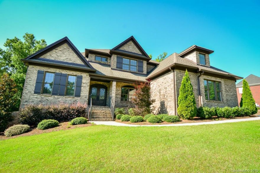 Welcome home! Gorgeous brick home with so many features they are listed in an attachment. Coffered ceilings, granite surfaces throughout, a stunning kitchen with huge island and stainless steel appliances, formal dining room, finished basement and many built-ins just to name a few. Access to the huge bonus/6th bedroom with full bath & laundry is behind the bookcase door in the upstairs hall - such a whimsical feature! Master suite is on the main level & there is an additional en-suite upstairs.