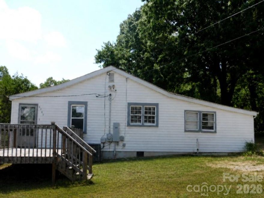 Nice 2 Bedroom 1 Bathroom Home Located on a Beautifull Oversized .68 Acre Lot in Gastonia. This home has lots of natural light throughout with nicely upgraded features including the laminate wood flooring, kitchen and bathroom. The kitchen features plenty of countertop and cabinet space with a full set of stainless-steel and black appliances including the refrigerator, range, dishwasher and microwave. Home also features two bedrooms, a full bathroom, a laundry area, a storage area, a utility room and a front deck. Exterior fenced backyard has plenty of space for a neighborhood cookout or just to entertain close family and friends. The location is perfect providing the privacy and peaceful living you expect but close enough to drive to Downtown Charlotte in less than 30 minutes. Shopping, restaurants, schools, expressways, Downtown Gastonia are all just a few minutes away. Please call to schedule a showing today!