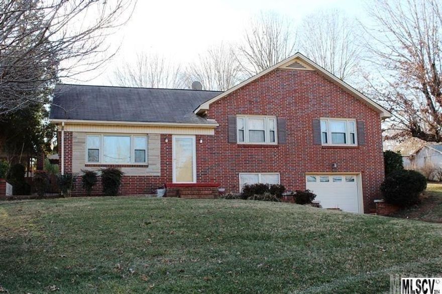 Beautiful, updated 3BR, 2BA brick home on over 1.5 acre corner lot in great Hildebran location less than 2 miles from interstate.  Home has 1-car garage, 3-car carport, detached storage shed and 4000+ square foot warehouse.   Home features large kitchen w/ updated countertops and tiled backplash and appliances, spacious dining area, large living room and adorable tiled sunroom- perfect for entertaining.  Beautiful hardwoods throughout.  Remodeled main bath has deep soaker tub and tiled shower surround.  Master suite has updated bath w/ tub and tiled shower surround. Nice den on second level. Adorable back patio w/ outdoor fireplace.  Lots of possibilities in warehouse located next door- perfect for a small business or storage.  Features hardwoods and multiple half-baths.