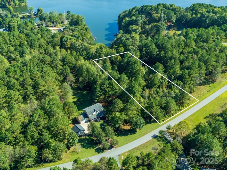 If you're looking for a special site to build your dream home this is it!!   This large lake view lot is in the fast growing Riverwalk community (RW) that is located on the shores of Lake Lookout Shoals in rural Iredell county.  The community is in a beautiful country area surround by farms, horses & cows, endless woods and creeks and away from the noise of the big city and is gated for even greater privacy and security.   Homes are all on wooded lots, some on waterfront lots and all have access to a beautiful beach and pavilion area and a boat launch controlled and maintained by a very active , self run HOA.   This is truly a one of a kind, diamond of a subdivision, a fabulous place to call home where you can  enjoy lake living including boating, fishing, swimming, and entertaining.  This lot is one of the few remaining lots that are near the water with a good water view and even close enough to access the water by foot.   Call showing service for instructions to enter gate.
