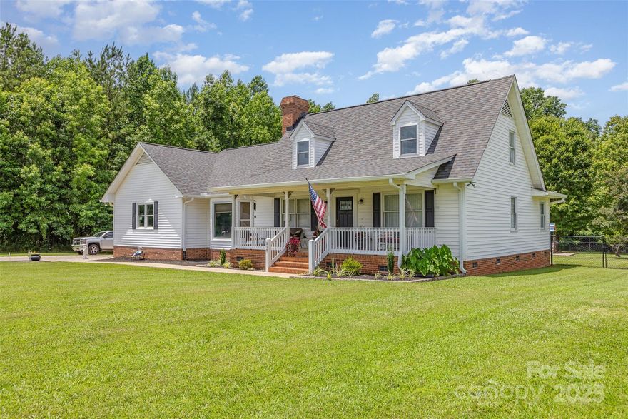 Beautifully updated Cape Cod full of warmth, charm, and modern touches in a great location! Fresh paint throughout the main level and upstairs baths, new carpet and pad in living room and stairwell, and a fully renovated hall bath w/ new flooring, vanity, mirror, lighting, fixtures, and toilet. The kitchen shines with painted cabinets, gas range, double-basin sink, added disposal, and updated lighting. Relax in the cozy living room featuring a whitewashed fireplace with gas logs and new mantle. Baths offer new vents & toilets; laundry features deep sink & cabinet storage. Major updates include new well pressure tank & switch, brand new roof (July 2024), gutters & downspouts (Sept 2024), and security floodlights. Enjoy endless storage with massive shed plus 2 car garage!  Entertain with ease on the fully renovated multi-level deck with café lights, firepit area, play set, and spacious fenced backyard—perfect for gatherings or quiet evenings under the stars!