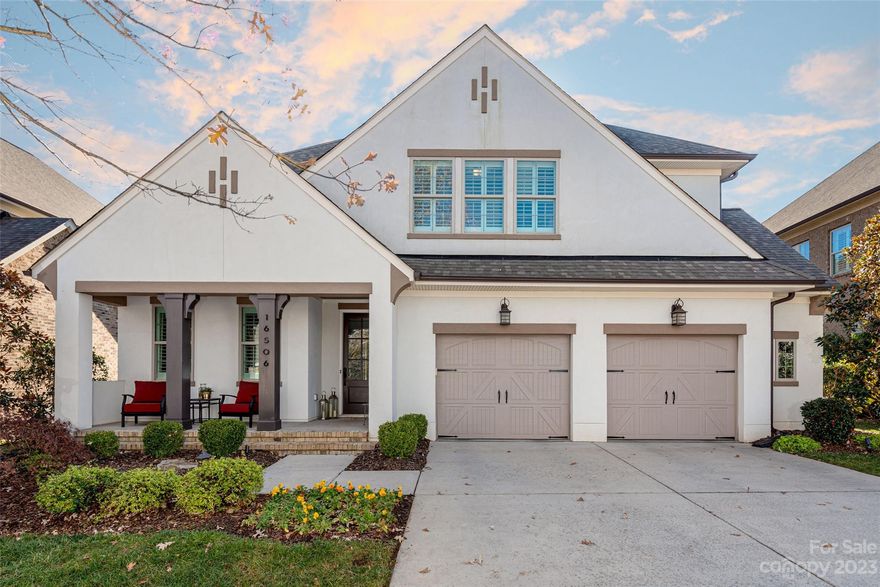 This beautiful 4-bedroom home has it all. It looks brand new with its lighting, cabinets, hardwoods, and carpeting. The chef can enjoy watching TV or mingling with others in the open floor plan with lots of light. The office is tucked off the foyer for a separate, quiet space. The guest room is also on the main level, along with a stunning full bath. The upstairs primary bedroom has an elegant bath and large dual closets. There's plantation shutters throughout the home. The cozy covered patio is within a fenced yard, surrounded by mature evergreen trees. And . . . have you discovered Robbins Park itself? This home is nestled amongst park land, with woods, walking trails, tennis/pickleball courts, a playground, and a ballfield. Plus, there's a private community pool. The trails connect to a greenway that extends from Birkdale Village in the South to the Publix in Cornelius in the North. Yes, this entire package is super close to I-77, shopping, medical facilities, and Lake Norman.