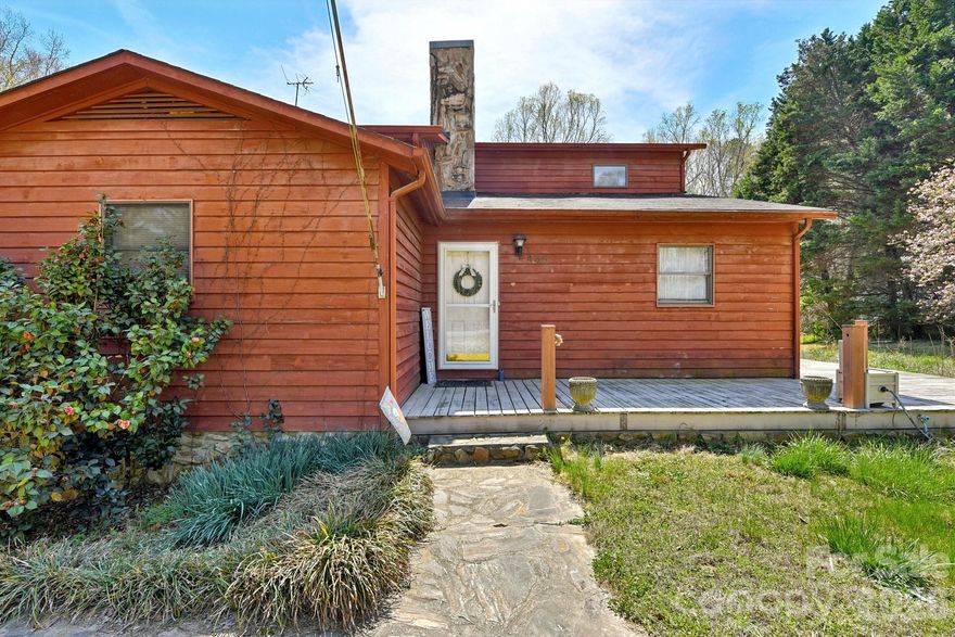 Tucked away on 1.26 acres, this inviting 4-bedroom, 3-bathroom home offers the perfect blend of space, character, and natural surroundings! The living room makes an immediate impression with vaulted ceilings, exposed wood beams, and a stunning stone-surround fireplace that creates a warm, cozy focal point.

The kitchen is complemented by a huge walk-in pantry, providing ample storage and functionality for everyday living. Generously sized bedrooms offer flexibility and comfort, while the unfinished basement adds even more room for storage or future possibilities.

Enjoy the peaceful setting from the wraparound porch, ideal for relaxing or taking in the views of the nearby creek. An additional storage building adds convenience for tools, hobbies, or outdoor equipment. A unique opportunity to enjoy privacy, charm, and room to spread out—all in one beautiful property!