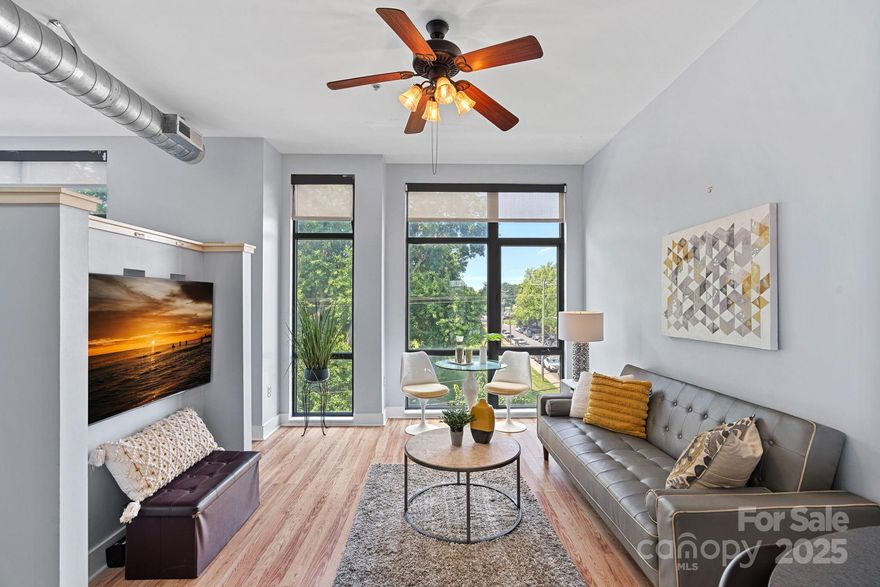 Uptown Charlotte furnished condo with amazing views of the city! BRIGHT OPEN Floor Plan offers huge windows and impressive high ceilings that provide lots of natural light & expansive feel for modern urban lifestyle. Kitchen has efficient design w/ refrigerator, all appliances & eat-in bar. Handy built-in desk & shelving, provide a dedicated work space for work or hobbies. Bathroom has tile floor and generous shower with modern black/white accents. Huge walk-in closet equipped with washer/dryer that remain. Ideal for anyone seeking a affordable city lifestyle! Located in 4th Ward, steps away from world class sports at BofA Stadium & Truist Field, dining like Alexander Michaels's, and entertainment spots like NC Music Factory & Spectrum Center. Silo Urban Lofts has elevator, parking lot with passes, easy access to interstate & airport. ALL appliances remain! Leases must be longer than 30 days. Water/Sewer/Trash included in HOA. SELLER WILL PAY FULL BALANCE OF SPECIAL ASSESSMENT AT CLOSING. Contact listing agent for list of furnishings that remain.