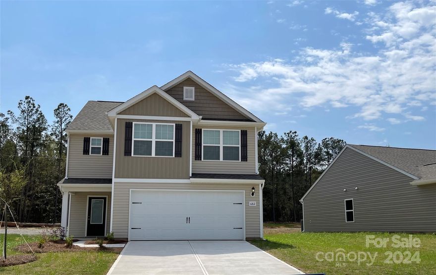 Enjoy the amazing floor plan that provides an easy living style due to the thoughtfully designed open floor plan.  The living room and kitchen are open for easy entertaining or help with homework!  This brand new 3-bedroom, 2.5 bathroom home features a chef ready kitchen complete with granite counters, Whirlpool brand stainless steel appliances, white cabinets with soft-close feature and crown molding for an added touch. Upstairs are 3 spacious bedrooms and wonderful closets.  The primary suit includes a vaulted ceiling, private bathroom and 2 walk-in closets - a challenge to see if you can fill them!  Attached 2-car garage and private backyard on a beautiful corner lot with only trees behind you.  It feels like an oasis yet convenient to all the comforts of shopping and dining.  Only 15 minutes from Great Falls White Water Park! Enjoy our beautiful neighborhood park.  This home is at the end of the road and has a great open lot.  Don't miss out on this brand new home!