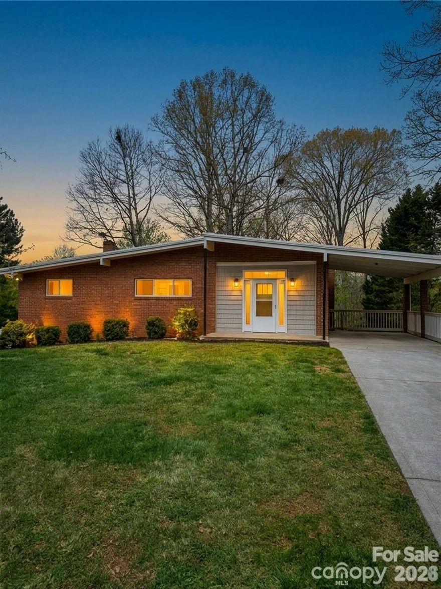 Beautifully updated 4BR/2BA mid-century brick home in a convenient Winston-Salem location. This property features an open-concept living and dining area with vaulted ceilings, exposed beams, and abundant natural light. Updated kitchen includes modern appliances, ample counter space, and a breakfast bar.

Finished walkout basement provides additional living space, ideal for a den, home office, or guest area. Spacious fenced-in backyard offers privacy and room for outdoor entertaining, pets, or play.

Low-maintenance brick exterior with distinctive architectural design and covered carport. Move-in ready with a great blend of character and modern updates—don’t miss this one!