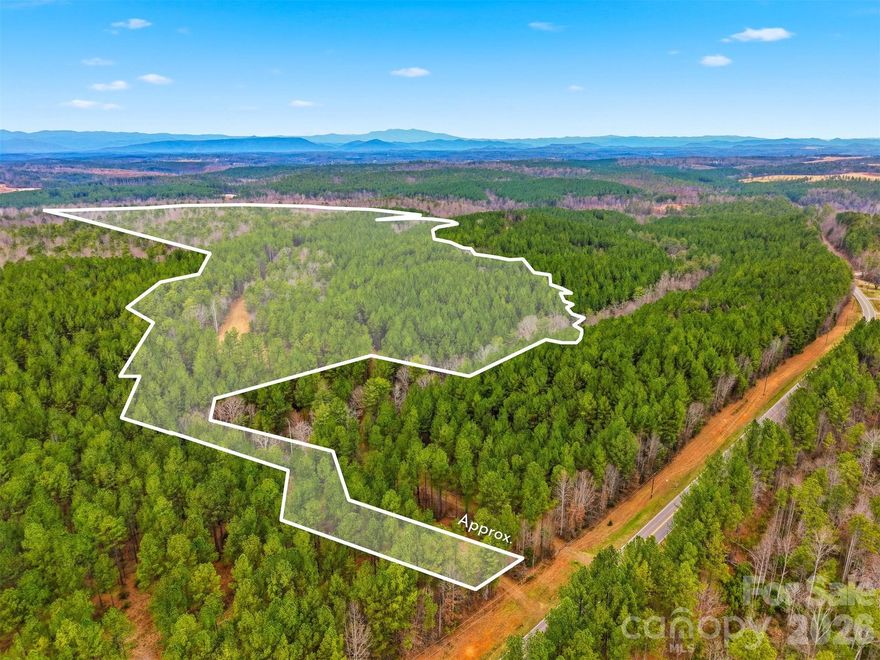 A truly rare offering along the Catawba River, this remarkable approximately 109+/-acre tract presents an exceptional opportunity for both estate buyers and long-term land investors seeking privacy, water frontage, and scale in one of Western North Carolina’s most desirable natural corridors. Properties of this size with direct river frontage are increasingly scarce, making this tract a standout acquisition for those who understand the long-term value of land. The property offers an impressive combination of seclusion, natural beauty, and versatility. Predominantly wooded with logging roads already in place, the land provides a private and peaceful setting ideal for a luxury estate, generational family compound, or recreational retreat, while still offering meaningful upside for investors looking to land-bank or hold a unique riverfront asset. The expansive acreage allows for multiple potential homesites, trails, and recreational uses without sacrificing privacy or views. The Catawba River frontage adds a distinctive and irreplaceable element—offering scenic views, natural buffers, and recreational enjoyment such as kayaking, fishing, and wildlife observation. Riverfront land of this scale provides not only lifestyle appeal, but also long-term intrinsic value that is increasingly difficult to replicate due to environmental protections and limited supply. There are no known easements, encroachments, or conservation restrictions currently affecting the property, and no known severance of timber, mineral, or development rights, allowing future owners flexibility in how the land is utilized. A survey/plat is available, with acreage reported at approximately 109 acres, supporting clarity for due diligence and planning. Utilities such as electric service, water access, cable, and high-speed internet are available nearby, enhancing the feasibility of estate development while maintaining the property’s rural character. As typical with land of this nature, septic evaluations should be completed during the buyer’s due diligence period. Whether you are an estate buyer seeking a once-in-a-generation riverfront setting or an investor recognizing the long-term value of large-acreage Catawba River land, this property delivers a rare blend of privacy, water frontage, and future potential. Opportunities like this are increasingly limited—secure your position in one of the region’s most enduring natural assets.